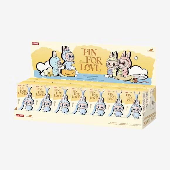 Labubu “A” from Pin for Love A‑M plush pendant with cream color and embroidered A on back.