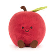 Plush toy shaped like a red apple with a smiling face on a white background